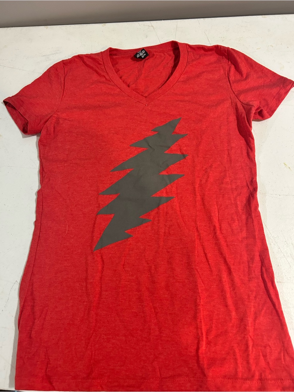 Women’s Red V-Neck Short Sleeve Tee with Graphic Bolt. Grateful Dead